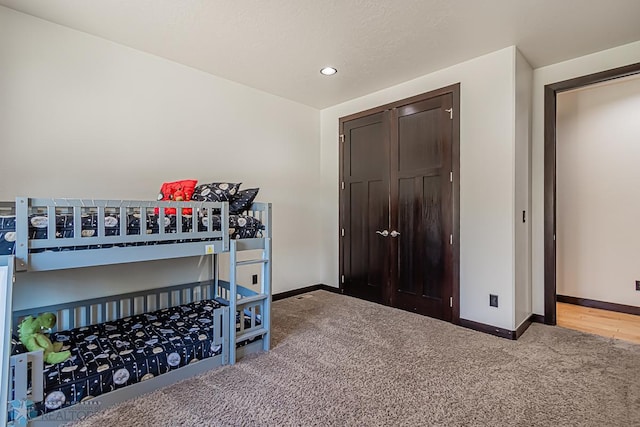 bedroom featuring hardwood / wood-style floors and a closet