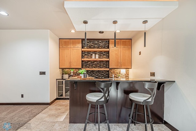 bar with hanging light fixtures, tasteful backsplash, and light tile floors