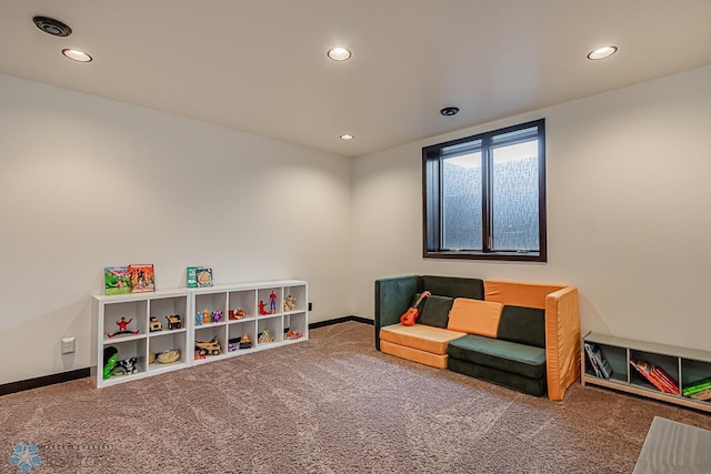 recreation room with carpet flooring