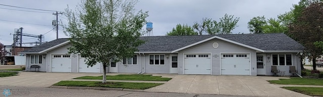 single story home with a garage