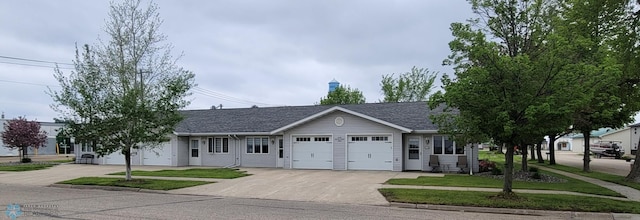 ranch-style home featuring a garage