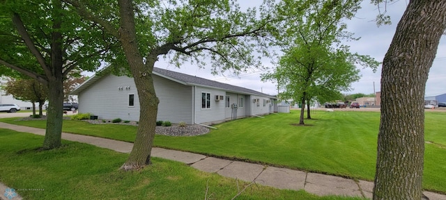 view of side of property featuring a yard