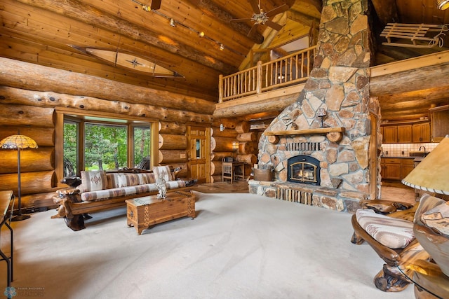 unfurnished living room featuring log walls, high vaulted ceiling, wood ceiling, ceiling fan, and a stone fireplace