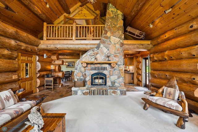 carpeted living room featuring beamed ceiling, a fireplace, rustic walls, ceiling fan, and wooden ceiling