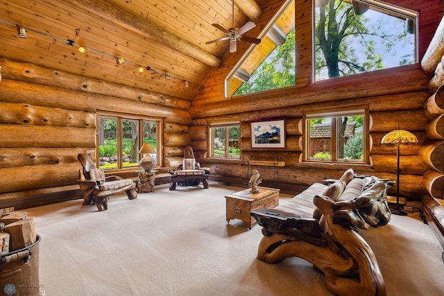 carpeted living room featuring high vaulted ceiling, log walls, beam ceiling, ceiling fan, and wood ceiling