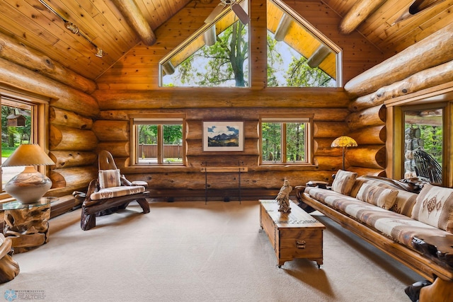 living room featuring high vaulted ceiling, rustic walls, a healthy amount of sunlight, and wood ceiling