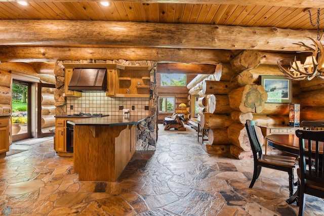 kitchen with custom range hood, backsplash, rustic walls, a notable chandelier, and wood ceiling