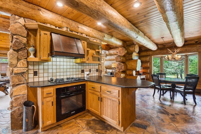 kitchen featuring a chandelier, tasteful backsplash, black appliances, rustic walls, and custom exhaust hood