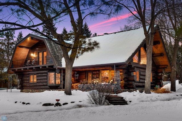 log cabin with a balcony