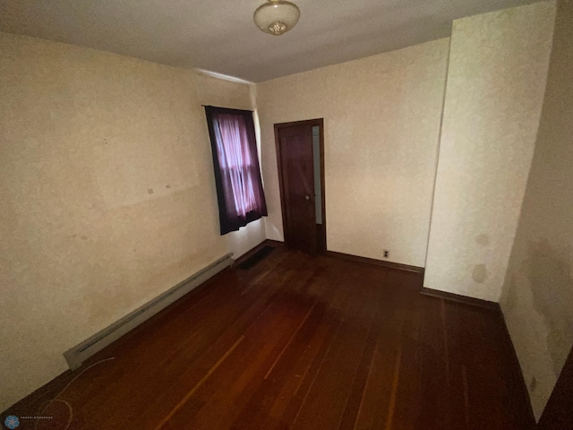 spare room with dark wood-type flooring