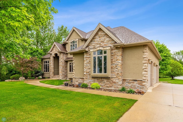 view of front facade with a front yard and a garage