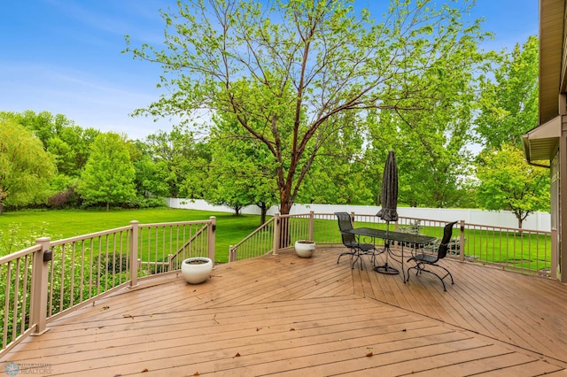 deck featuring a lawn