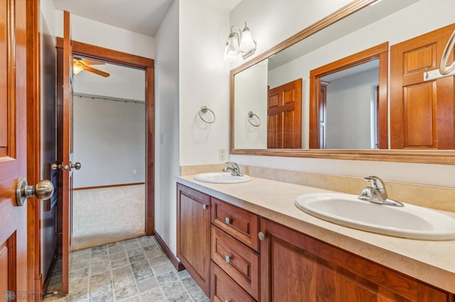 bathroom featuring large vanity, tile flooring, double sink, and ceiling fan