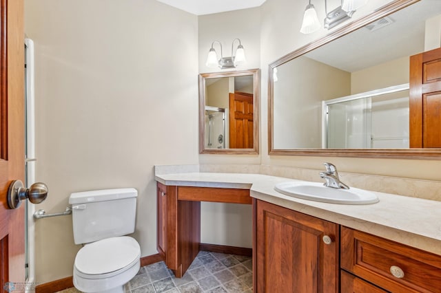 bathroom with vanity, toilet, and tile floors