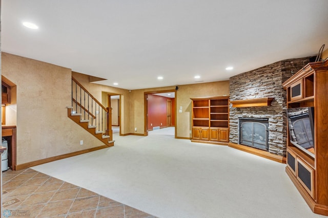 unfurnished living room with a stone fireplace and light tile flooring