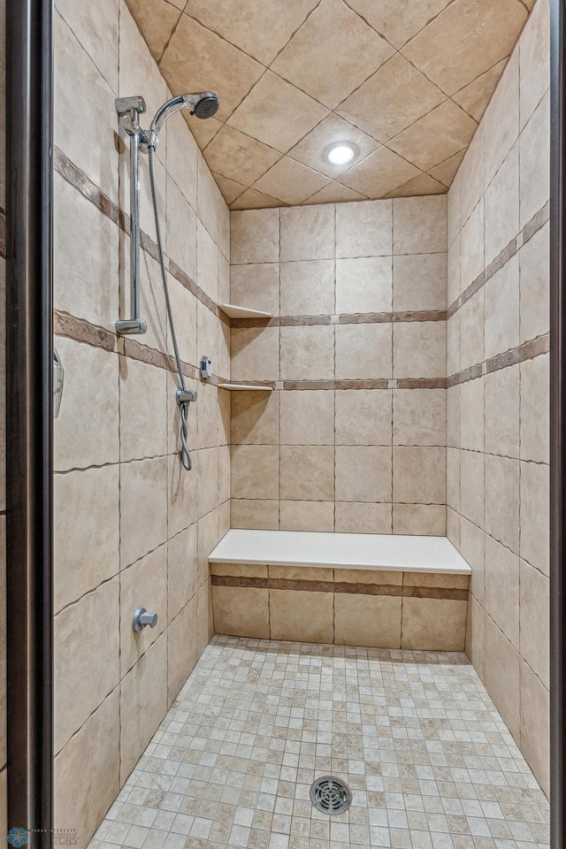 bathroom featuring tiled shower