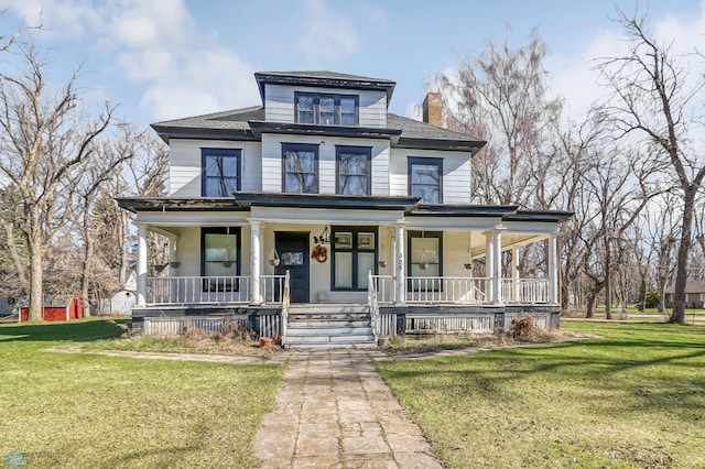 view of front of home featuring a front yard and a porch