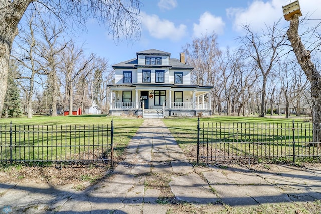 victorian-style house with a porch and a front lawn