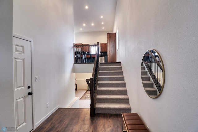 staircase featuring hardwood / wood-style floors