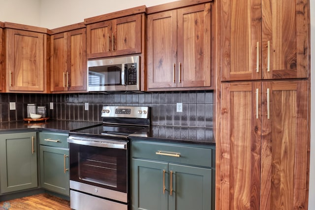 kitchen featuring light hardwood / wood-style floors, tasteful backsplash, and stainless steel appliances