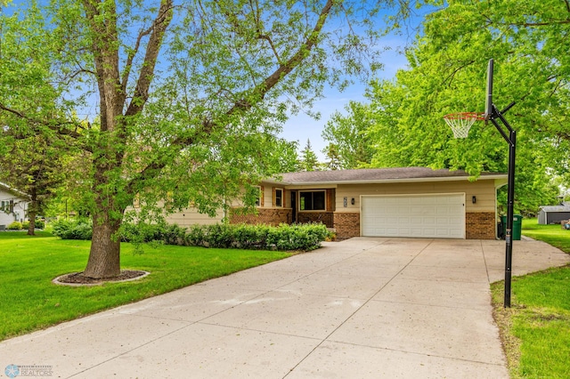 view of front facade with a front yard and a garage