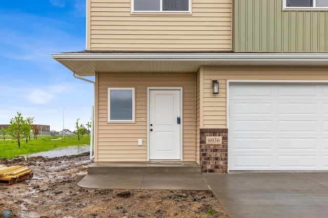 entrance to property featuring a garage