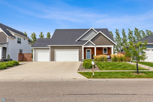 view of front of property featuring a garage and a front yard