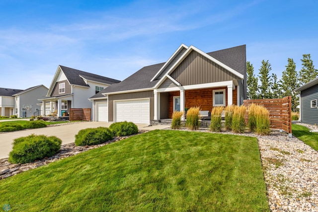 view of front of home with a front lawn and a garage