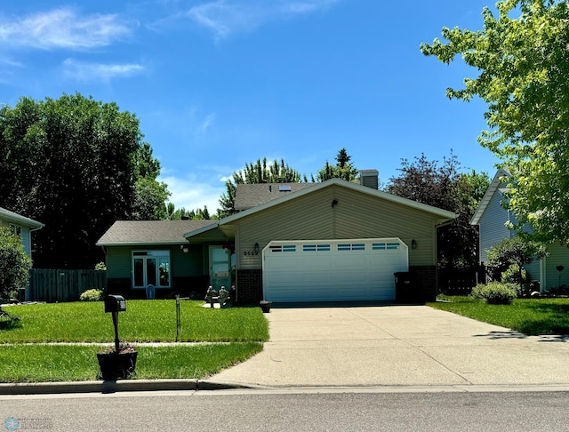 single story home featuring a front lawn and a garage