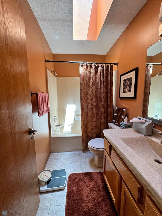 full bathroom with tile patterned flooring, shower / tub combo, a skylight, toilet, and vanity