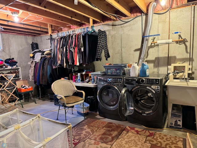 clothes washing area with washer and dryer