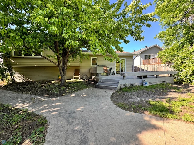 view of front of home with a wooden deck