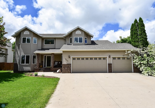 view of front of home with a garage and a front yard