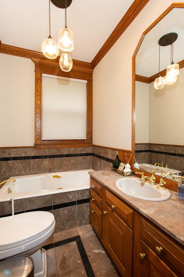 bathroom featuring tiled tub, vanity, crown molding, tile patterned floors, and toilet