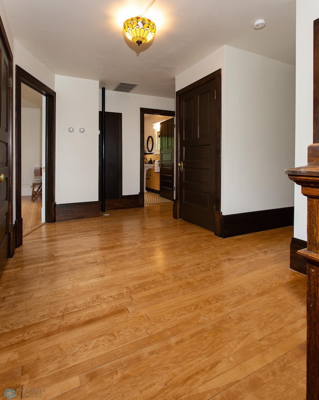 spare room featuring light hardwood / wood-style flooring