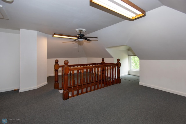 bonus room featuring ceiling fan, vaulted ceiling, and carpet floors