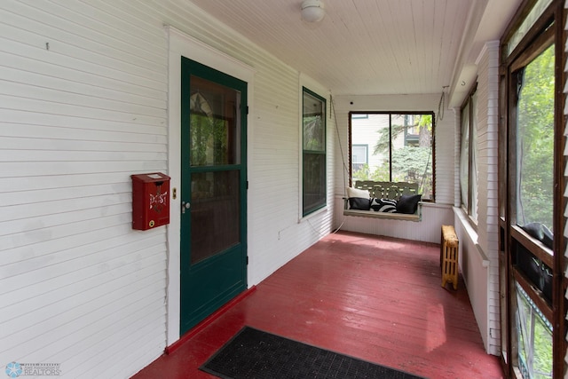 sunroom / solarium featuring radiator