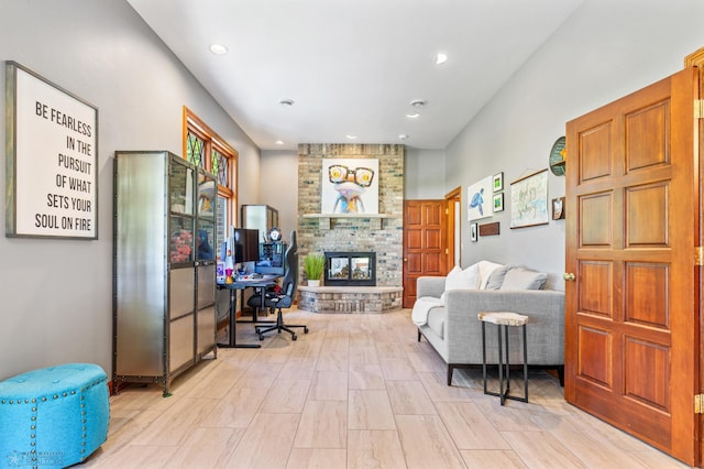 tiled office space with a multi sided fireplace and brick wall