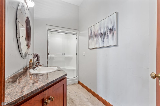 bathroom with vanity with extensive cabinet space and tile floors