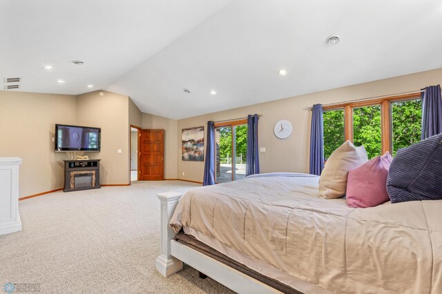 carpeted bedroom with access to outside and lofted ceiling