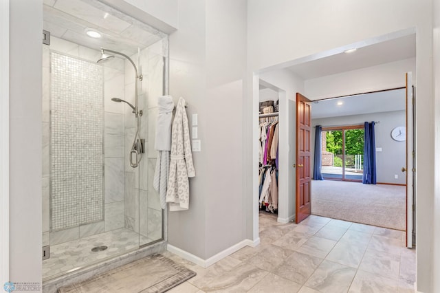 bathroom featuring an enclosed shower and tile floors