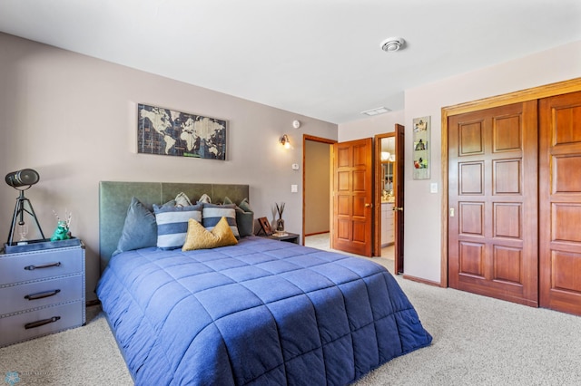 carpeted bedroom featuring a closet