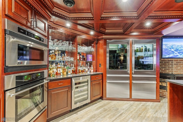 kitchen with coffered ceiling, light hardwood / wood-style floors, wine cooler, beamed ceiling, and stainless steel double oven