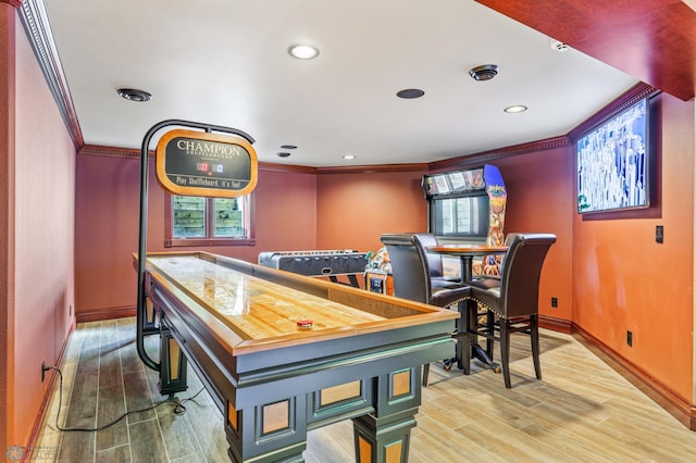 game room with crown molding and hardwood / wood-style floors