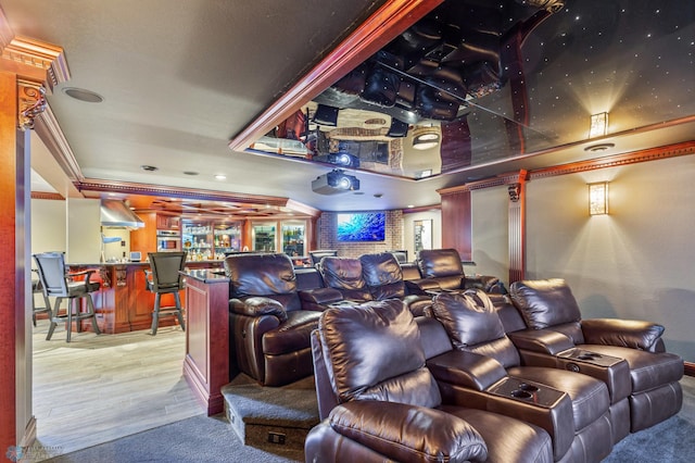 home theater featuring crown molding and wood-type flooring