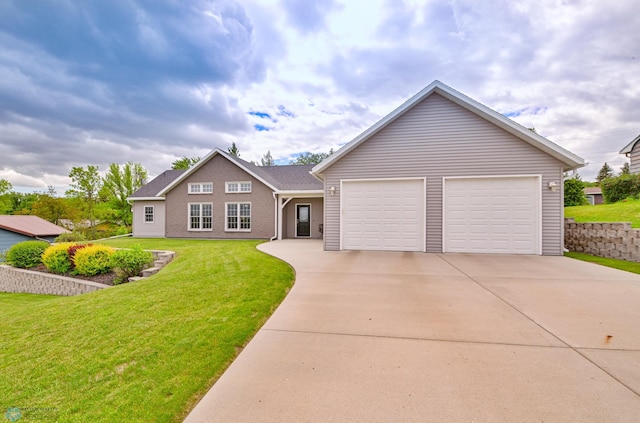 view of front facade with a garage and a front lawn