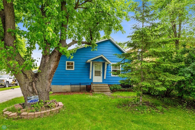 bungalow with a front yard