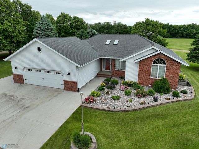 view of front of house with a front yard and a garage