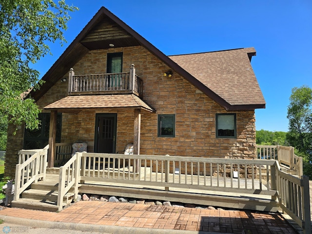 exterior space with a deck and a balcony