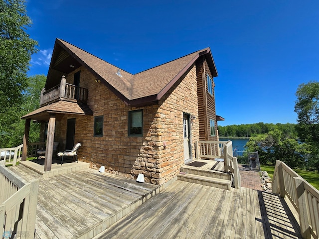 wooden terrace with a water view